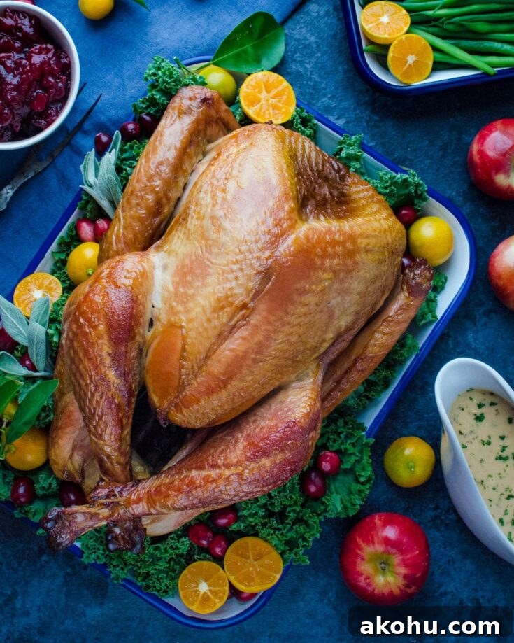 smoked turkey on a bed of greens with fresh fruit garnish.