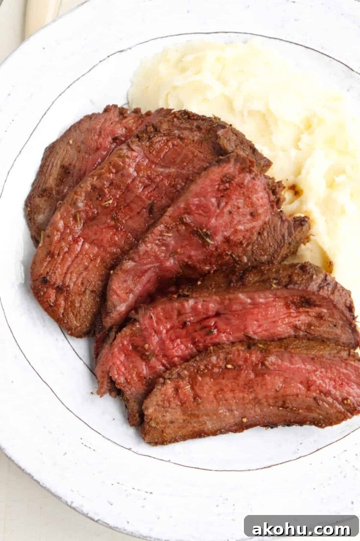 Roast venison on a plate.
