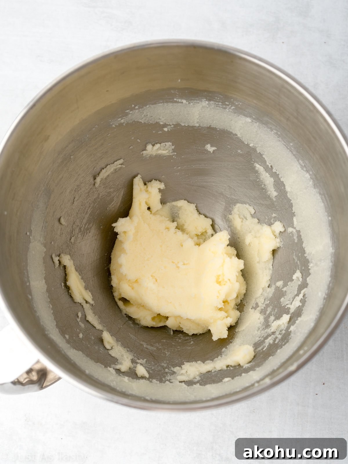 Lemon-Glazed Raspberry Ricotta Cake: Moist Italian Dessert 5 Creamed butter and sugar in a bowl.