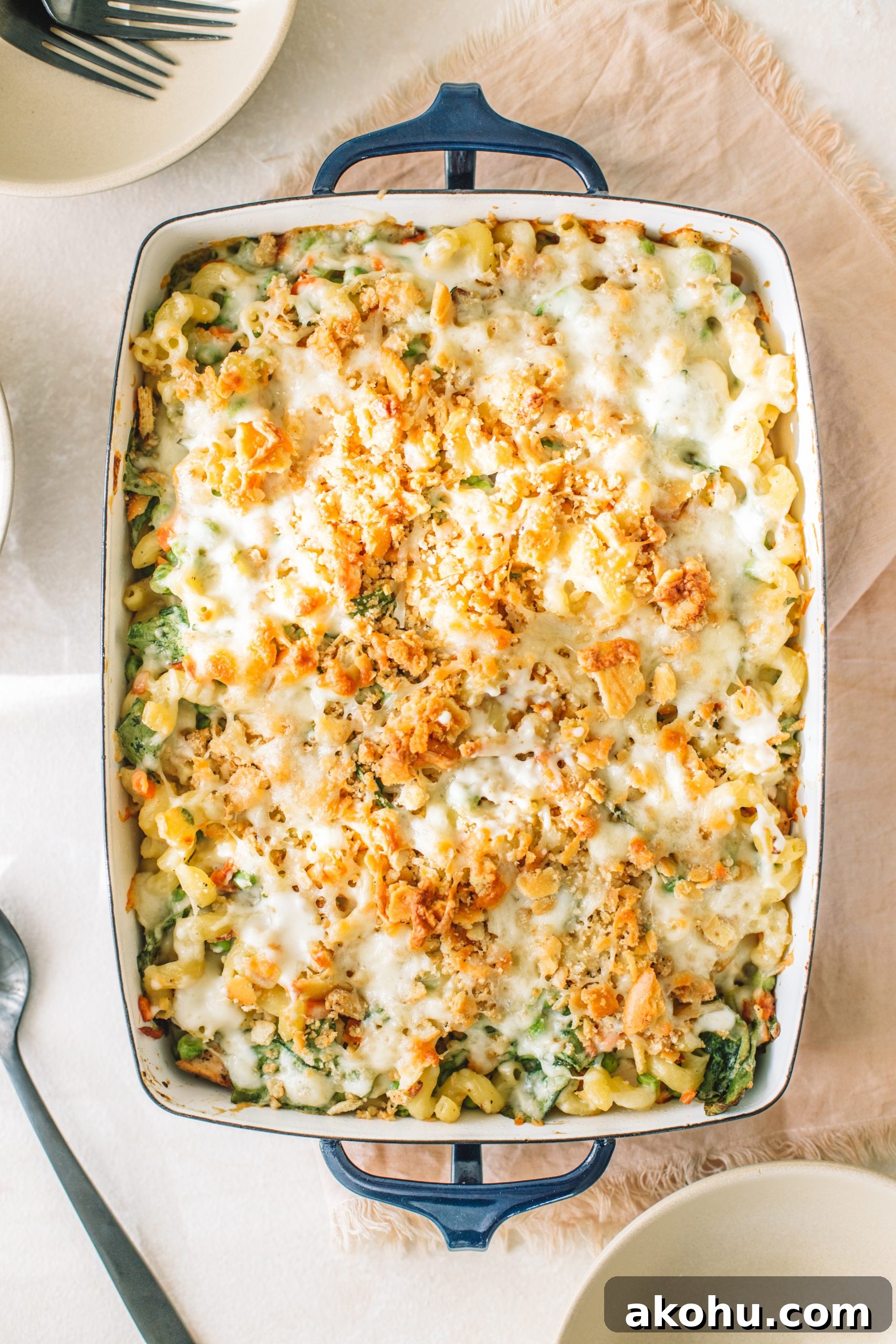 Homemade Tuna Noodle Casserole Recipe From Scratch 2 A casserole dish filled with tuna noodle casserole from scratch that has been baked.