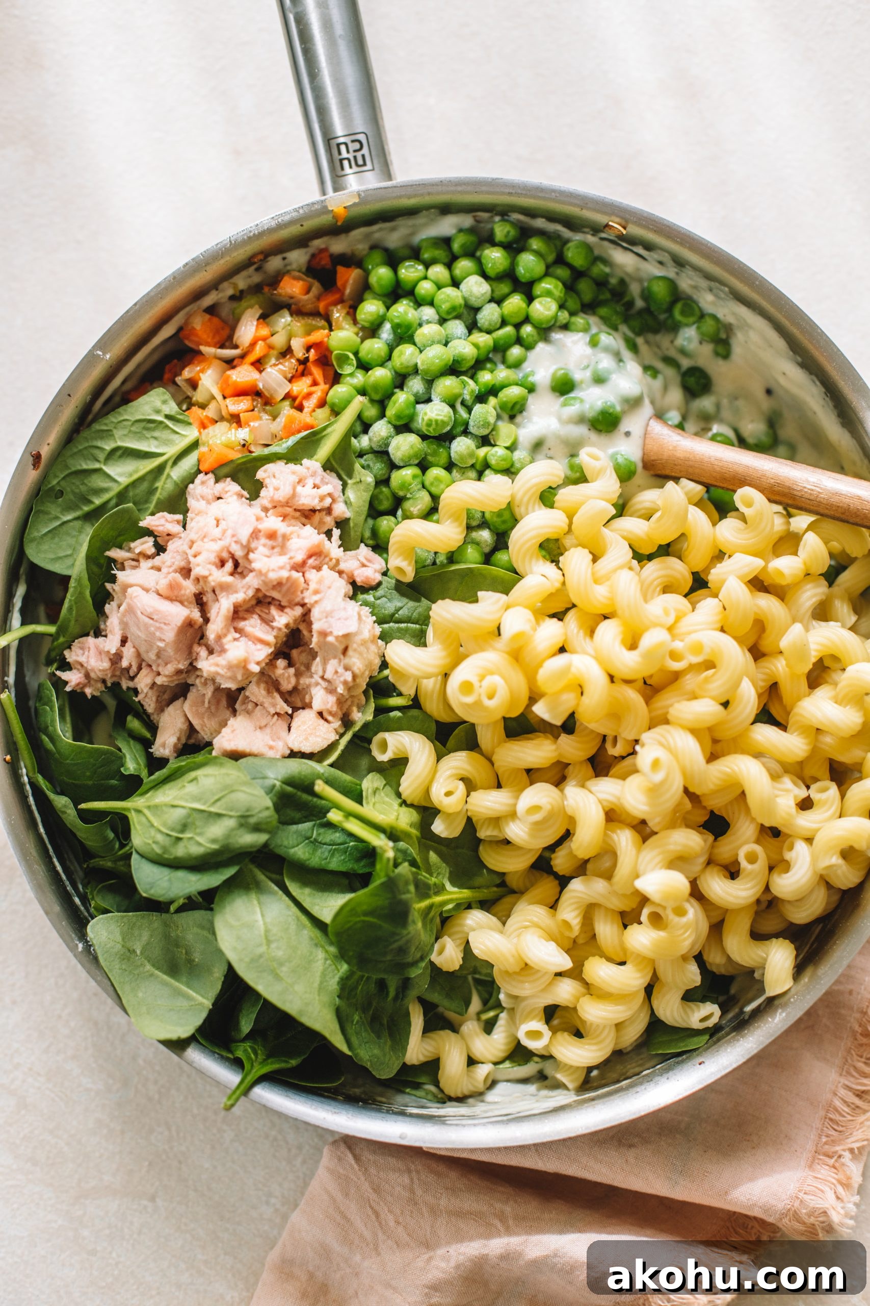 Homemade Tuna Noodle Casserole Recipe From Scratch 6 Ingredients for tuna noodle casserole in a skillet ready to be transferred to a casserole dish.