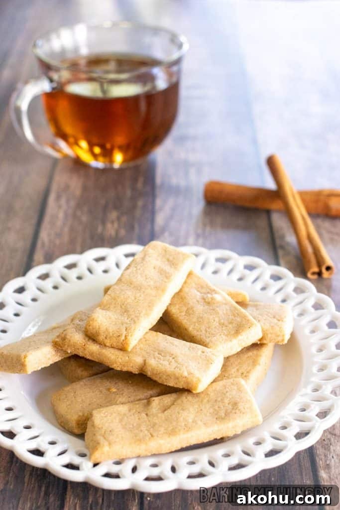 cinnamon shortbread cookies recipe on small decorative plate with tea behind