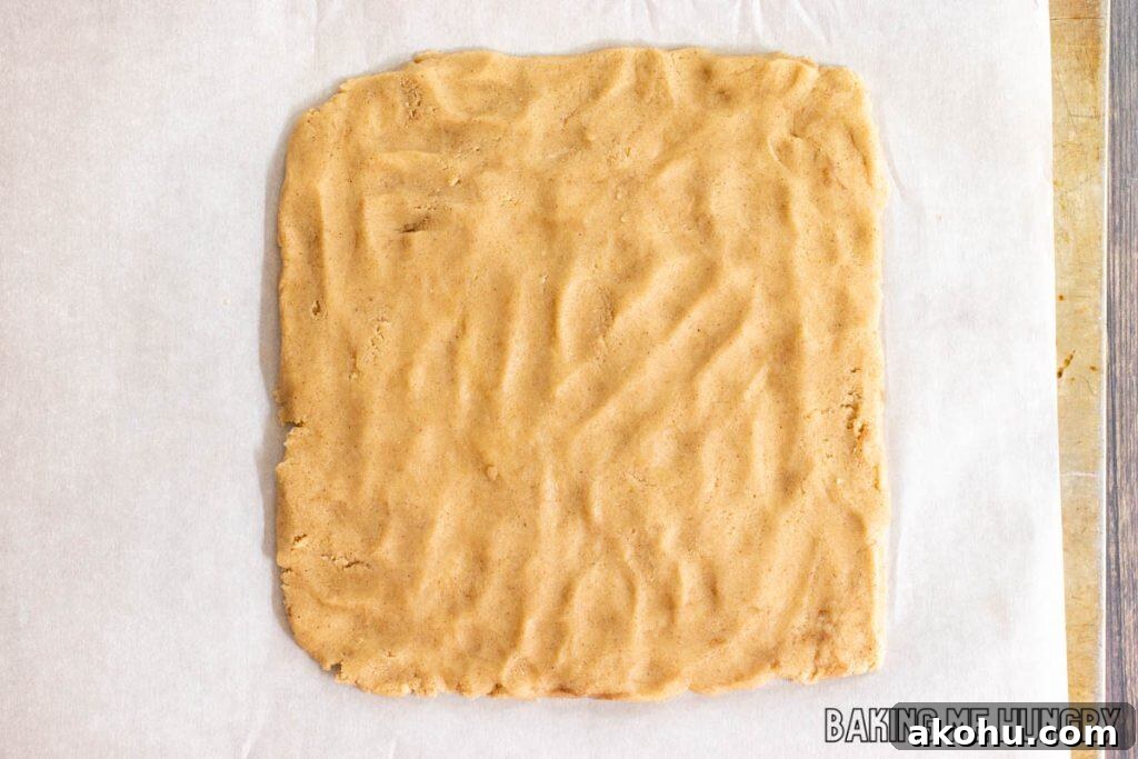 dough pressed into a square on parchment