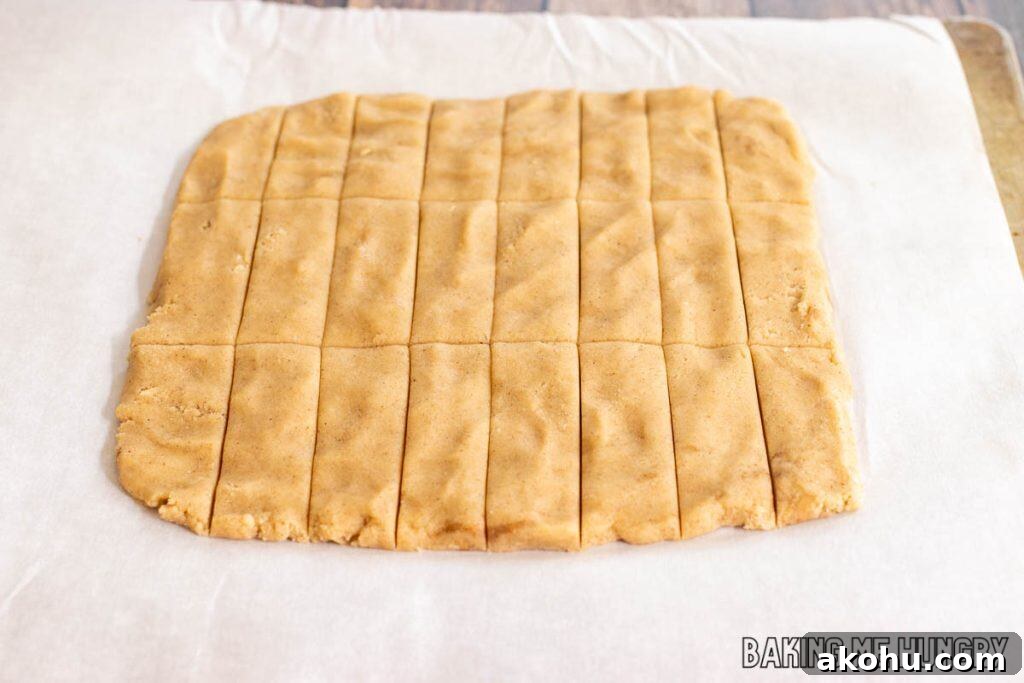 square of dough cut into rectangles on parchment