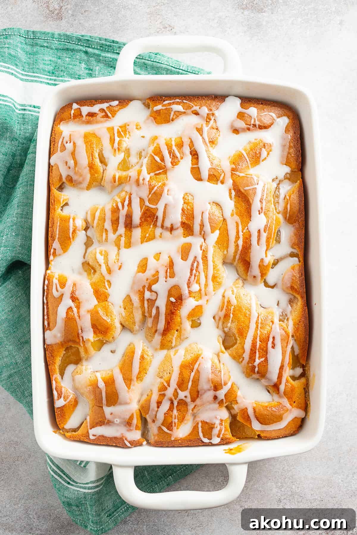 Apple Pie Filling Coffee Cake Recipe — Warm, Spiced Dessert 9 Apple Pie Filling Coffee Cake drizzled with a glaze.