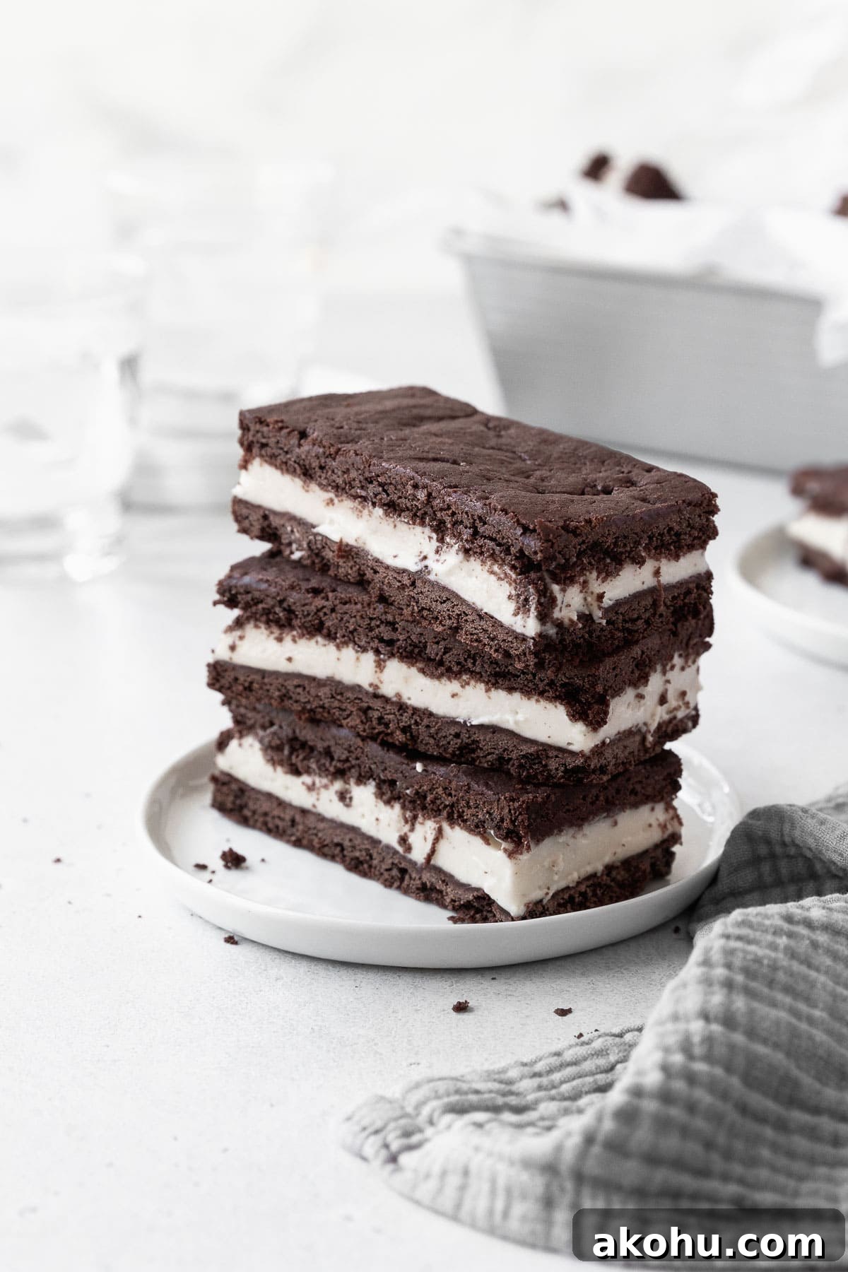 Gluten-Free Ice Cream Sandwiches You’ll Love 2 A stack of gluten-free ice cream sandwich cookies on a white dish.