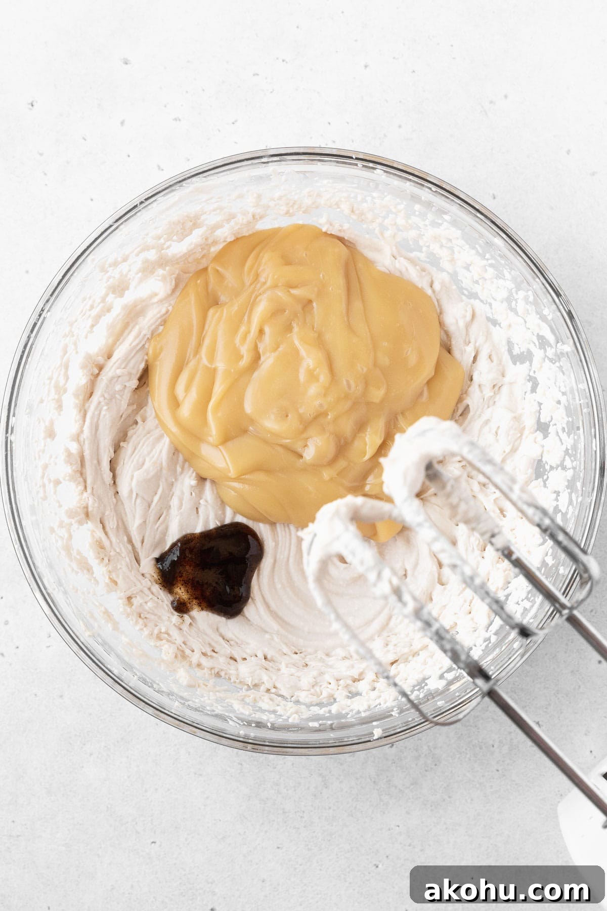 Gluten-Free Ice Cream Sandwiches You’ll Love 11 Adding the sweetened condensed oat milk and vanilla to the glass mixing bowl.