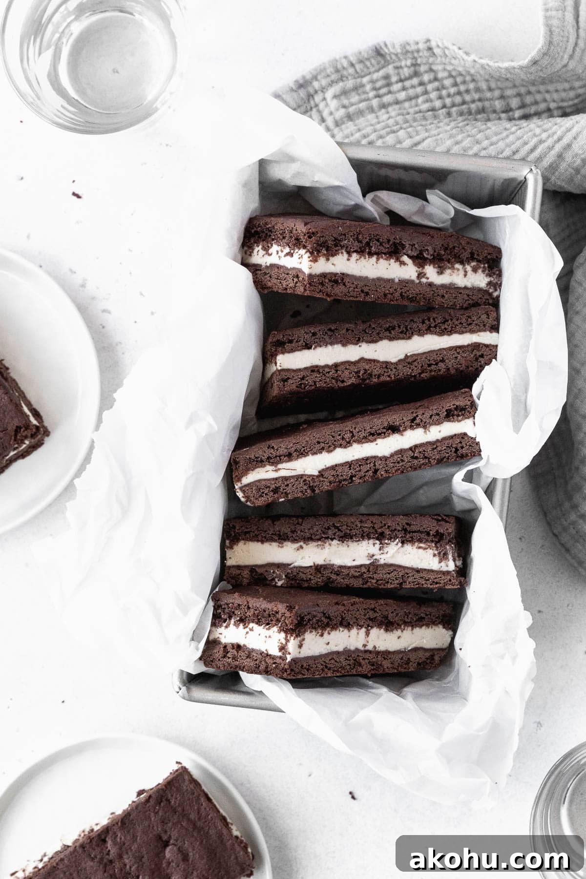 Gluten-Free Ice Cream Sandwiches You’ll Love 15 Ice cream sandwich cookies in a parchment paper-lined loaf pan.