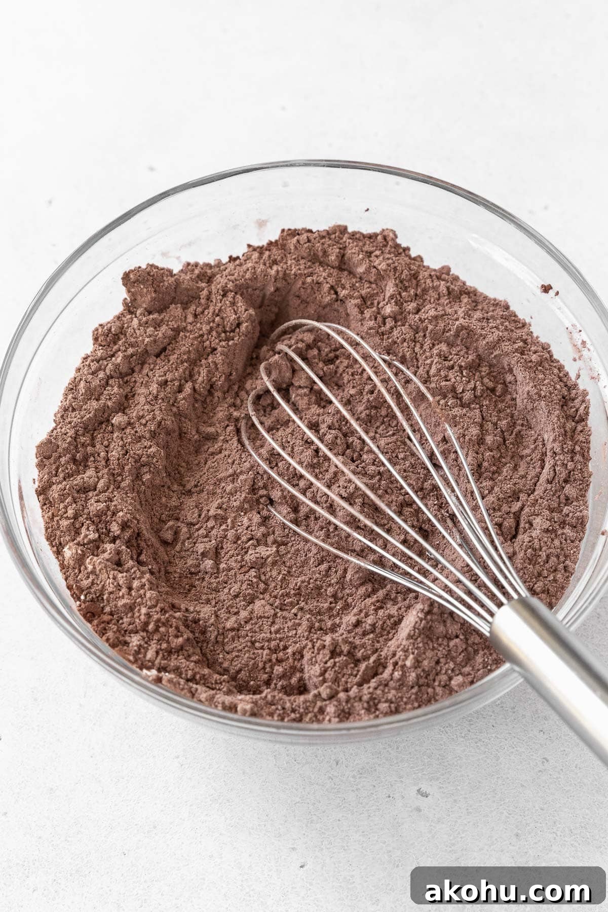 Gluten-Free Ice Cream Sandwiches You’ll Love 5 A glass mixing bowl of flour and cocoa.