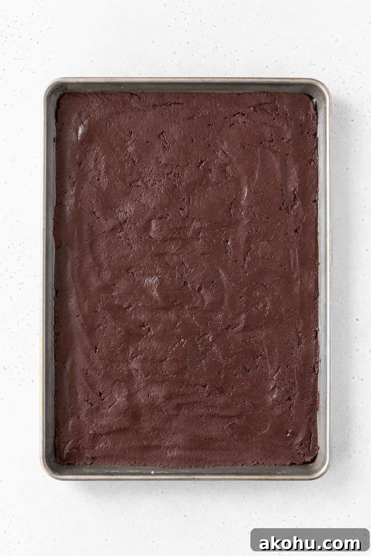 Gluten-Free Ice Cream Sandwiches You’ll Love 8 Chocolate sandwich cookie batter spread out on a baking sheet.