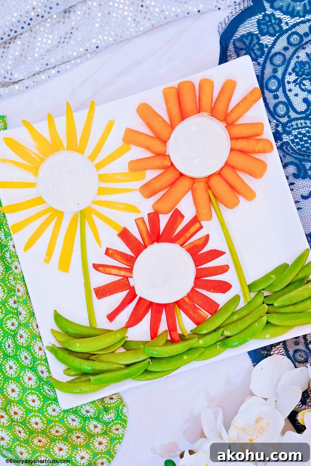 Blooming Vegetable Platter: Stunning Veggie Flower Tray Tutorial 8 veggie flowers with ranch dressing on a white platter