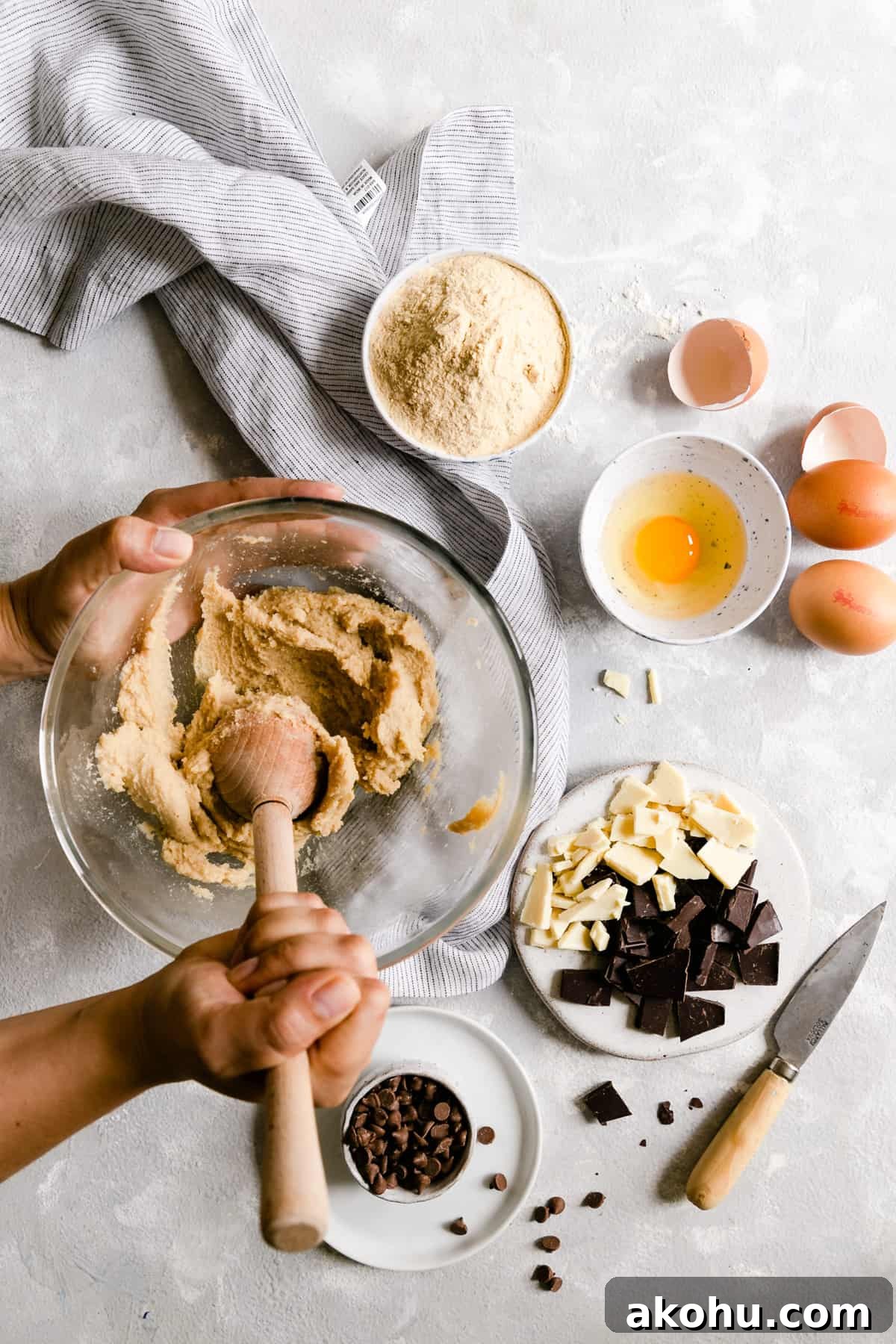Overhead shot of a person beating butter and sugar in a large bowl