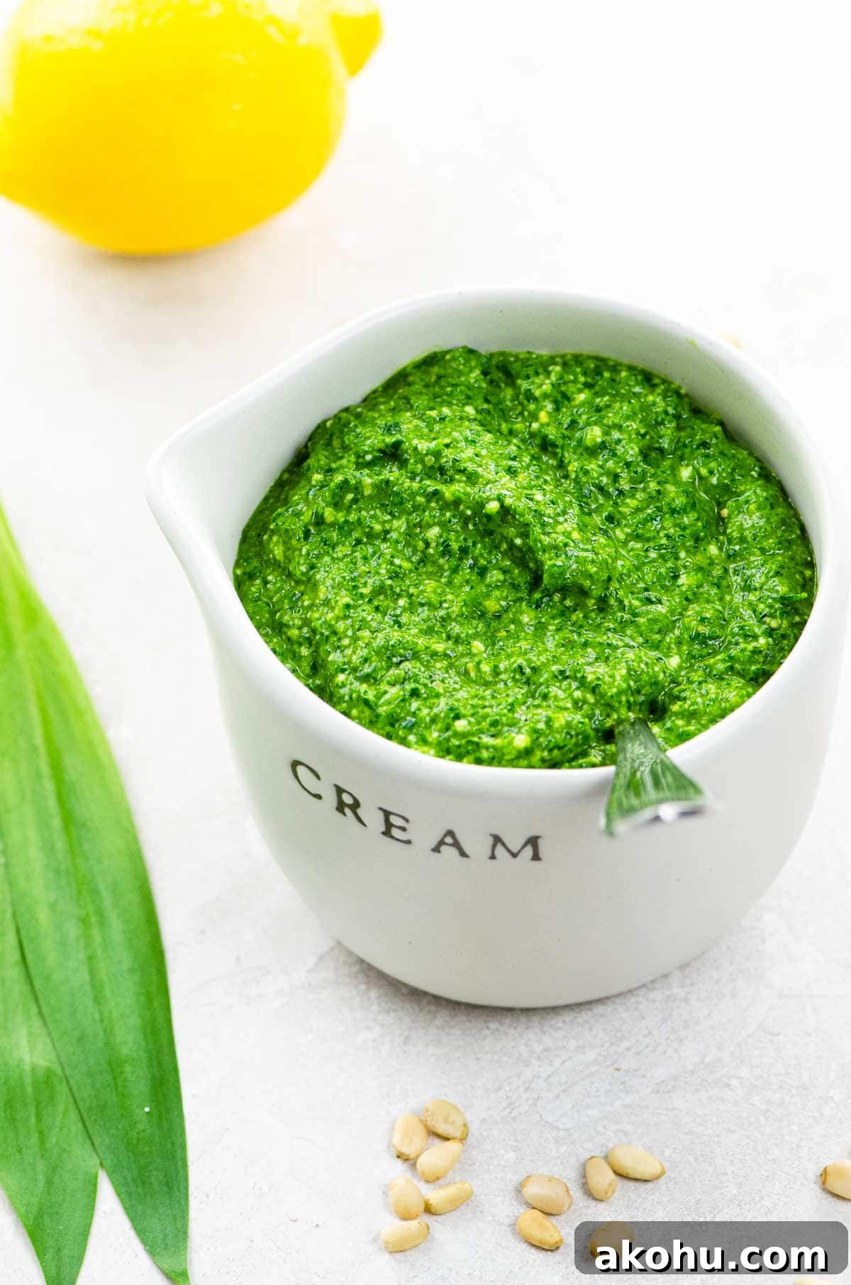 Ramp Pesto with Fresh Basil and Spinach: Spring Garlic Sauce 6 ramp pesto in a small pitcher with ramp leaves, a lemon, and pine nuts