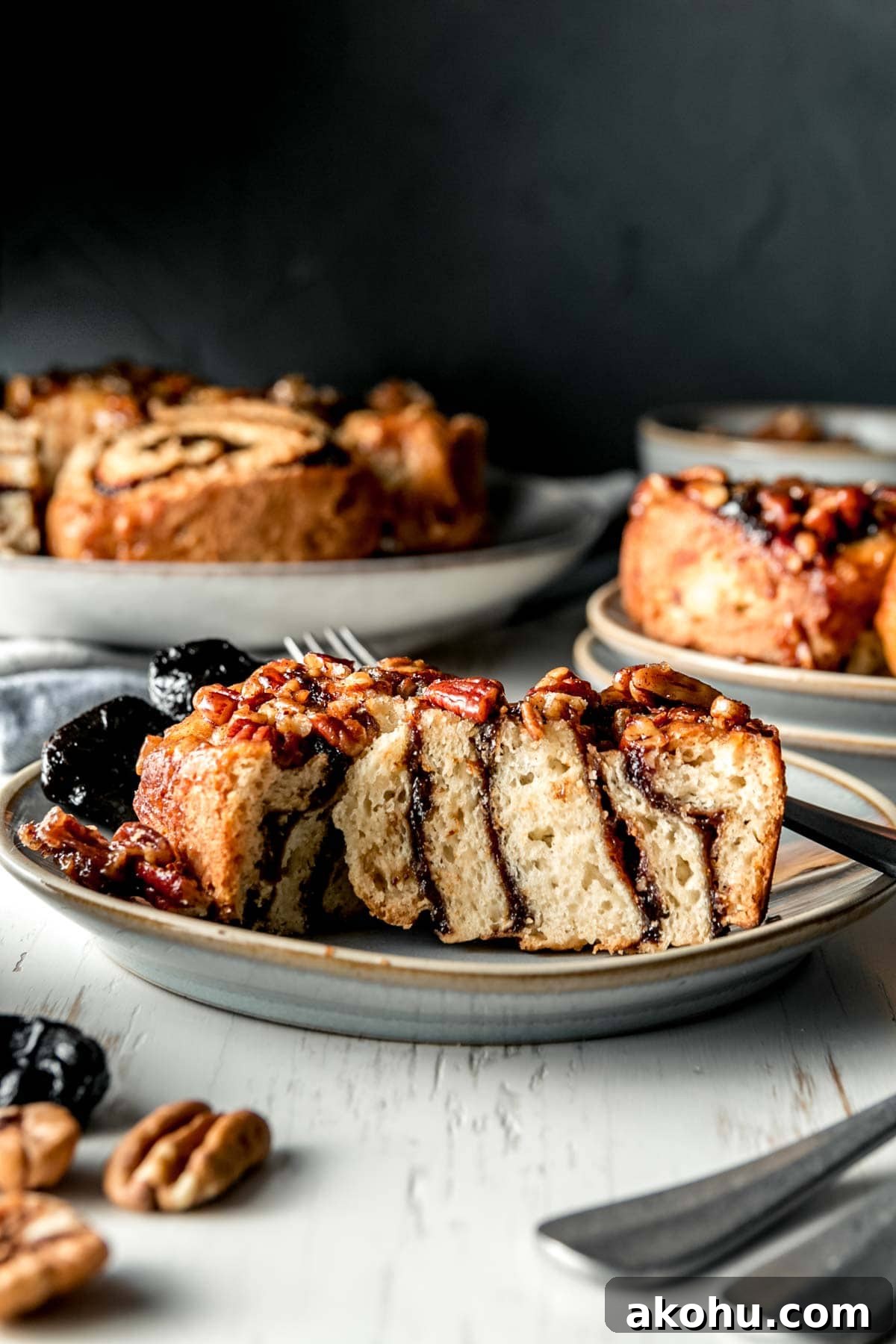 Cross section of gluten free prune sticky bun showing prune layers.