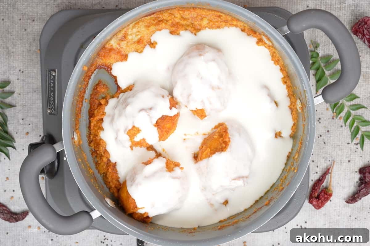 Yogurt added to the pan.