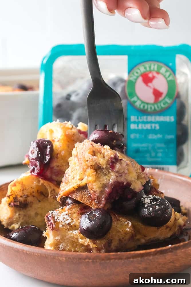 Fork going into part of the blueberry French toast casserole