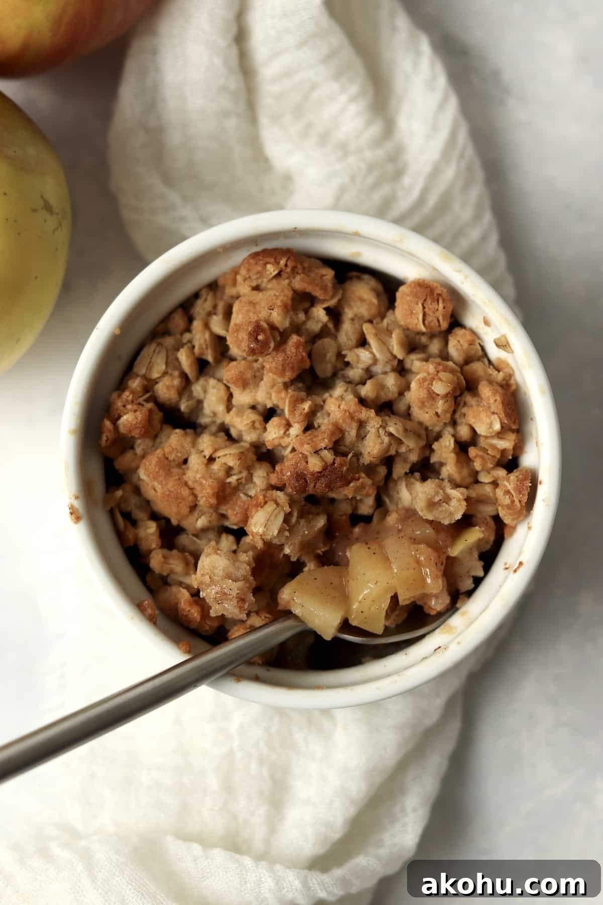 Individual Apple Crisp with Oat Topping — Single-Serve Recipe 2 Single serve apple crisp in a ramekin with an oat topping.