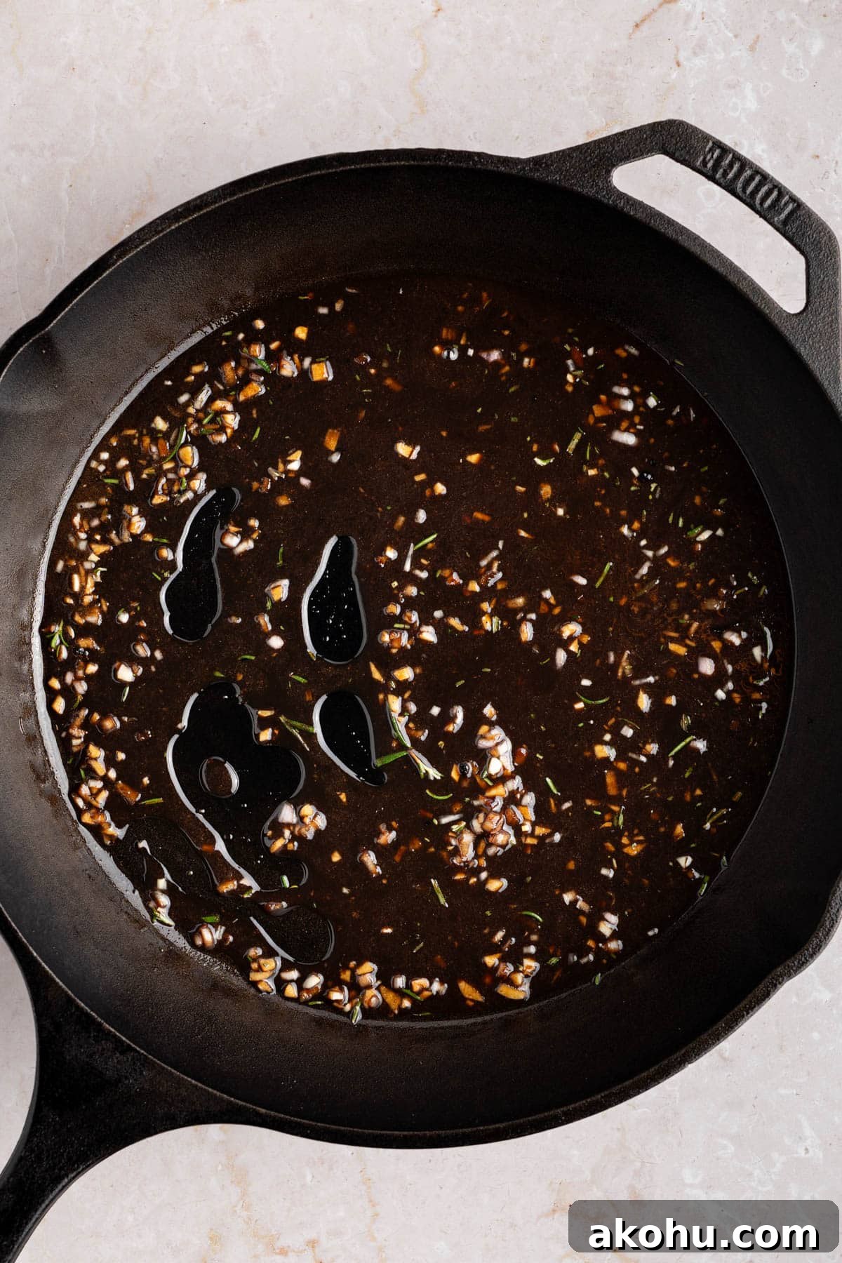 Balsamic-Glazed Oven Roasted Lamb Chops for Dinner 7 The glaze cooking down in the skillet.