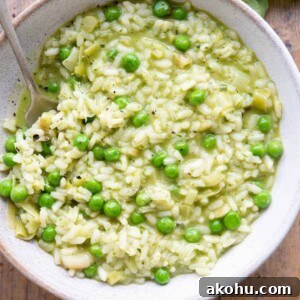Creamy Pea and Basil Pesto Risotto 12 A close up of a bowl of risotto with pesto and peas