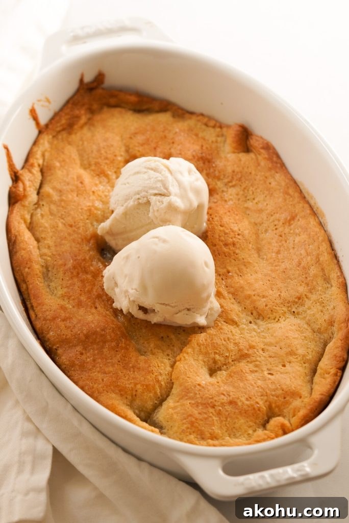 peach cobbler topped with vanilla ice cream