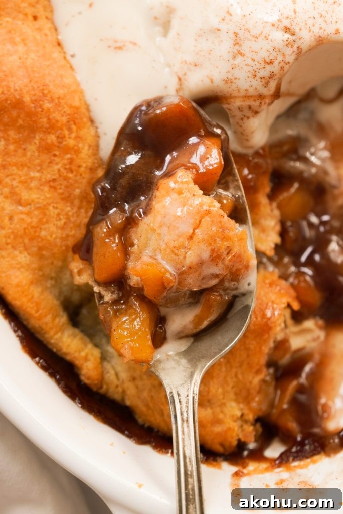 spoonful of peach pie filling and crescent roll dough