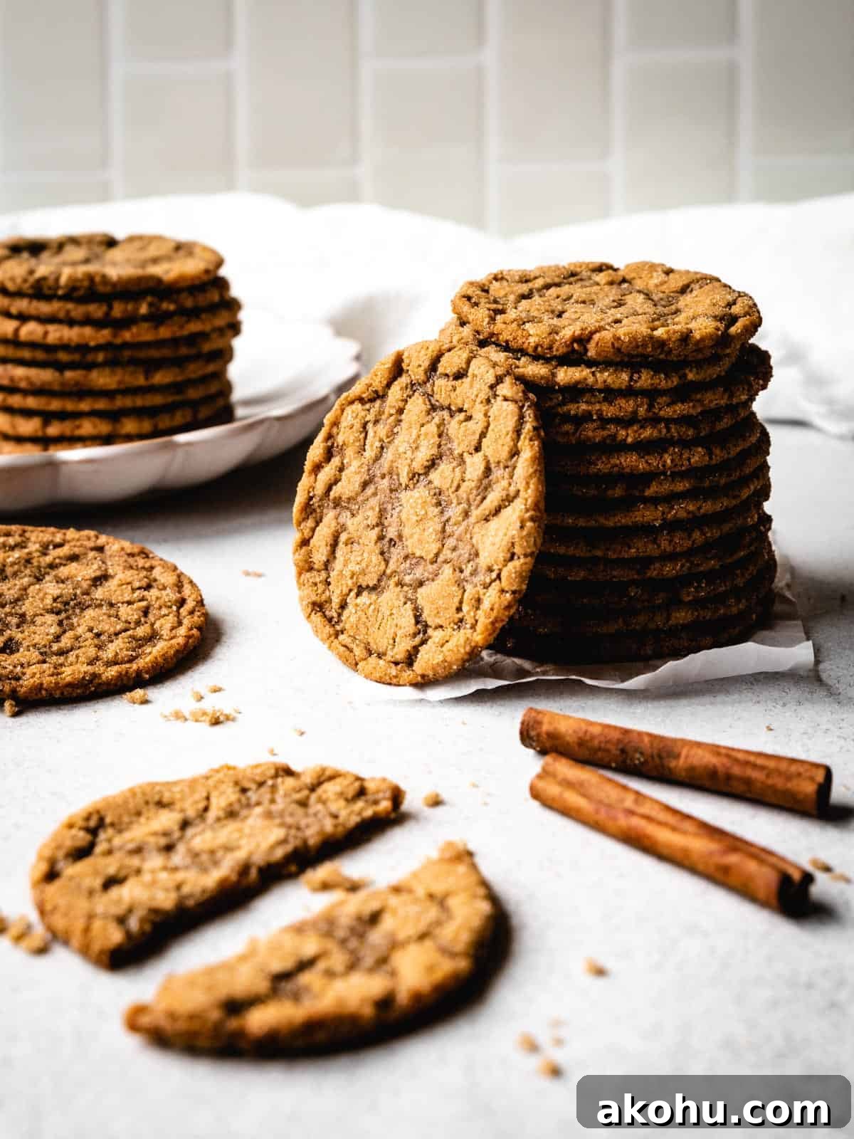 stack of brown sugar cookies with one leaning on the stack