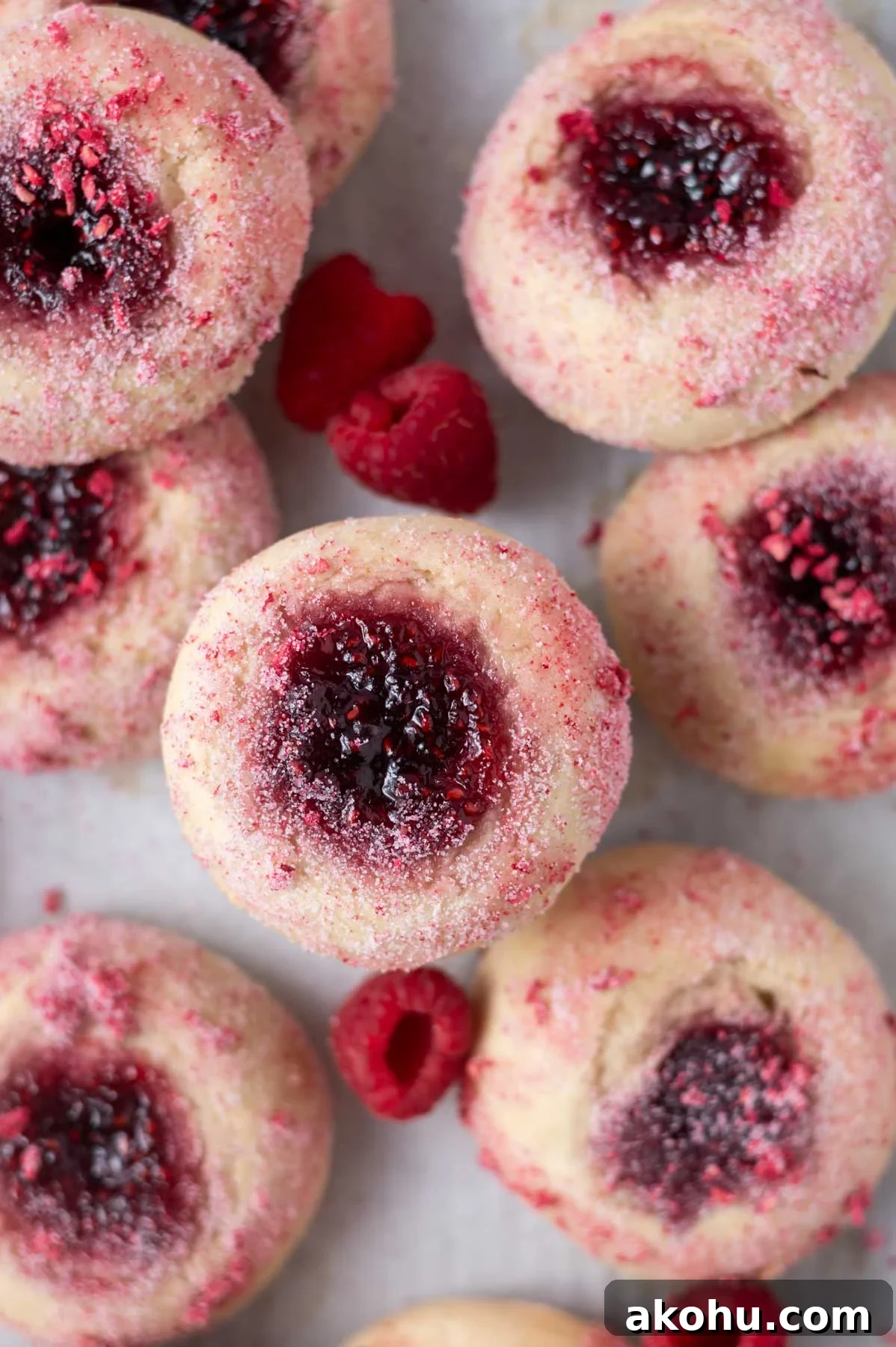 Yeast-Raised Baked Raspberry Donuts: Soft, Glazed Recipe 3 overhead look at jam filled donuts with fresh raspberries