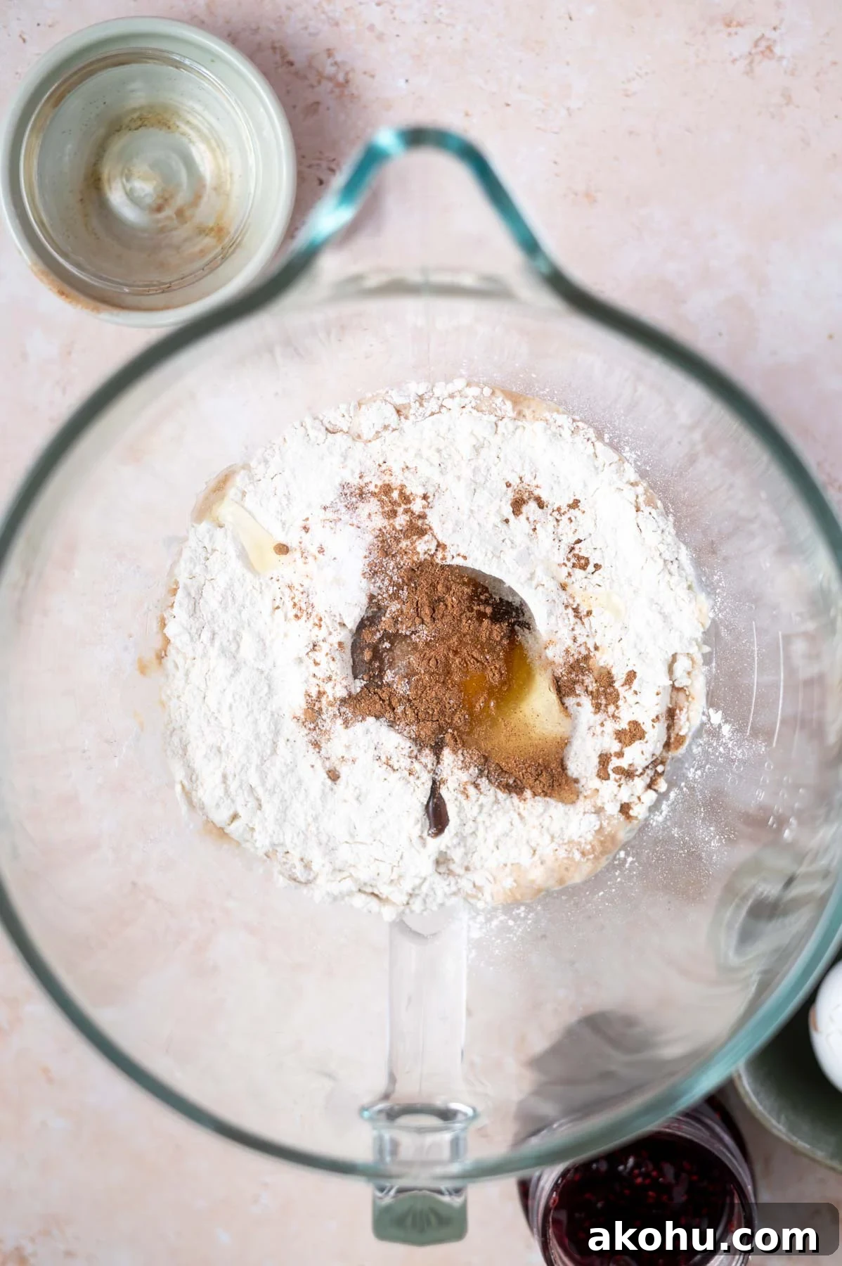 Yeast-Raised Baked Raspberry Donuts: Soft, Glazed Recipe 6 flour, egg, nutmeg and salt added to yeast in a mixing bowl