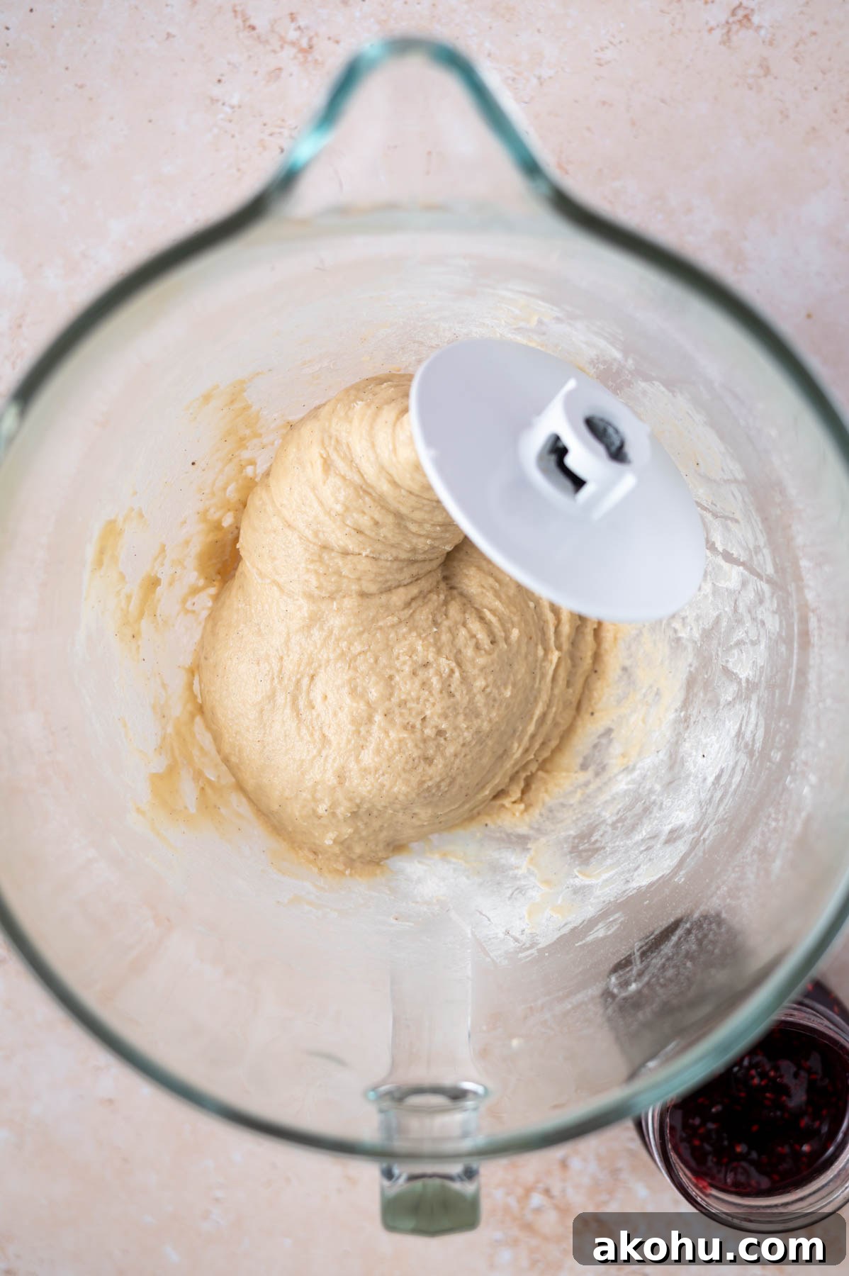 Yeast-Raised Baked Raspberry Donuts: Soft, Glazed Recipe 7 donut dough in a mixing bowl with the dough hook