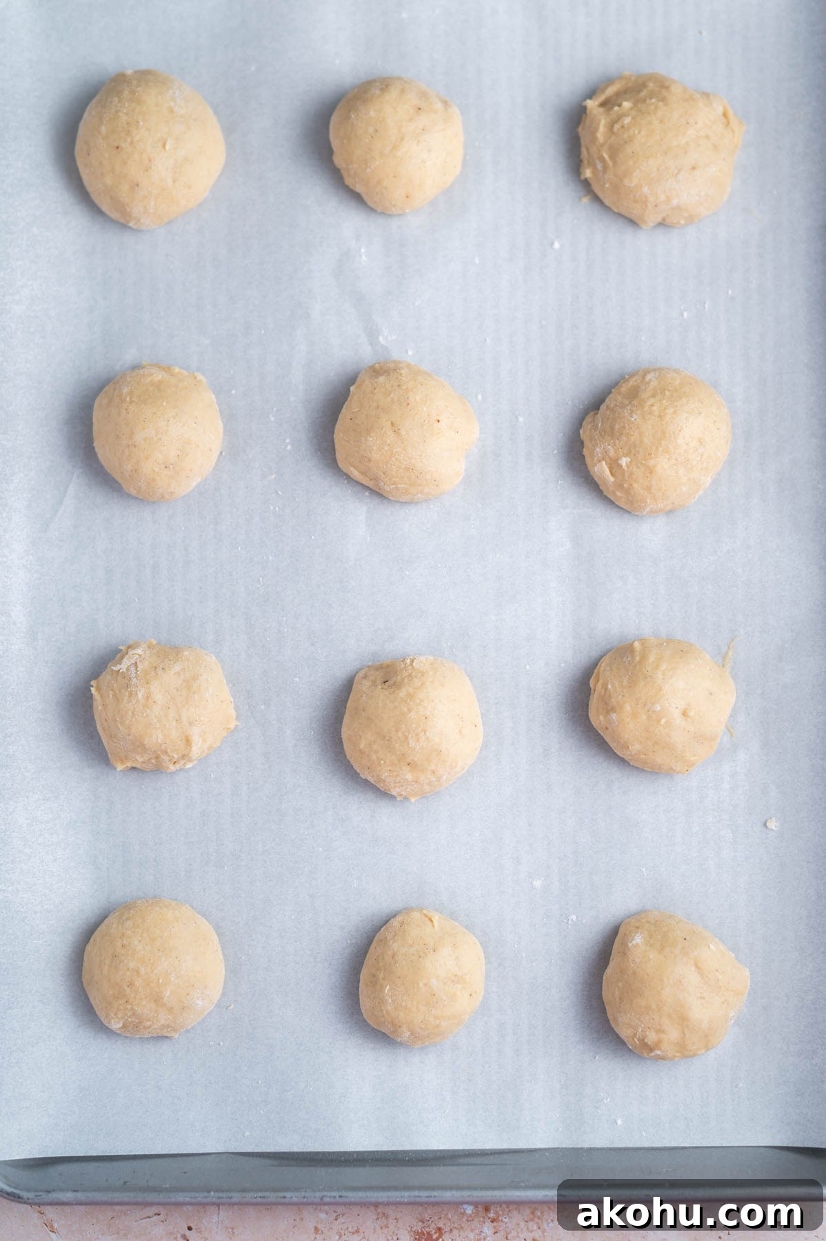 Yeast-Raised Baked Raspberry Donuts: Soft, Glazed Recipe 8 12 donuts resting on parchment lined baking pan