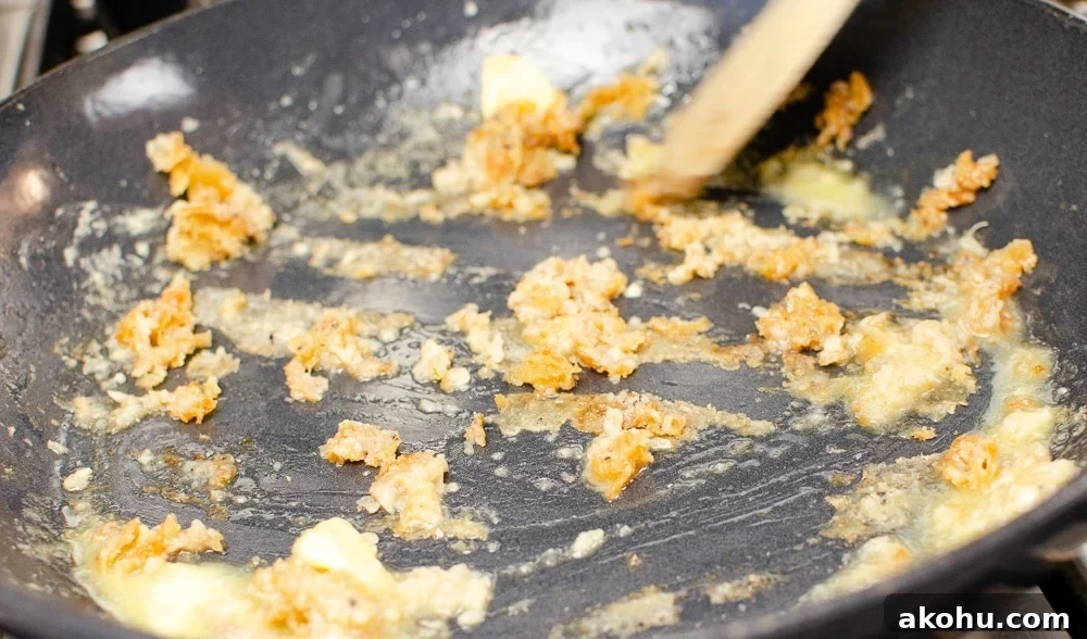 scraping the cornstarch of the bottom of pan with the rice wine vinegar and butter to make our sizzling spicy pork
