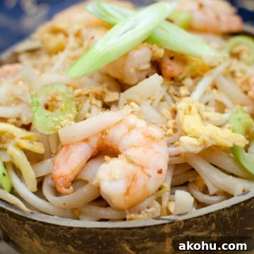 Close up picture of our pad thai noodles with prawns, eggs crushed nuts and chopped spring onions