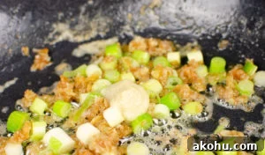 spring onions and Gia garlic puree in the pan.