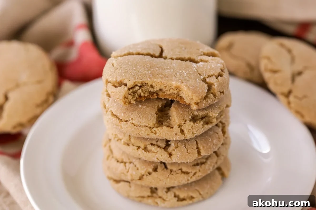 Brown sugar cookies are sweet, soft, and ultra chewy. They are a TASTY twist on a much-loved classic cookie. Brown sugar cookies stacked on a white plate