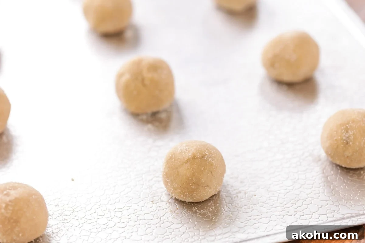 Brown sugar cookies are sweet, soft, and ultra chewy. They are a TASTY twist on a much-loved classic cookie. Brown Sugar cookie balls lined up on a cookie sheet