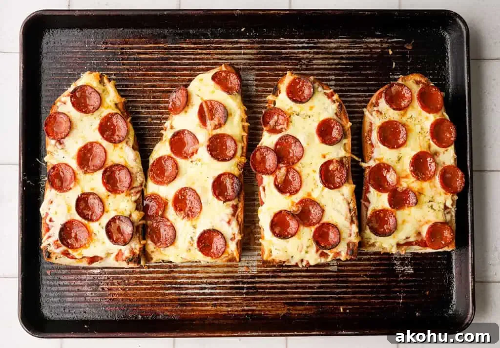 Crispy French Bread Pizza Recipe: Quick Weeknight Dinner 5 four french bread pizza slices on a baking sheet