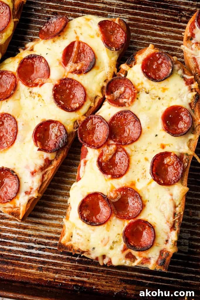 garlic bread pizza toppings close up view of french bread pizza
