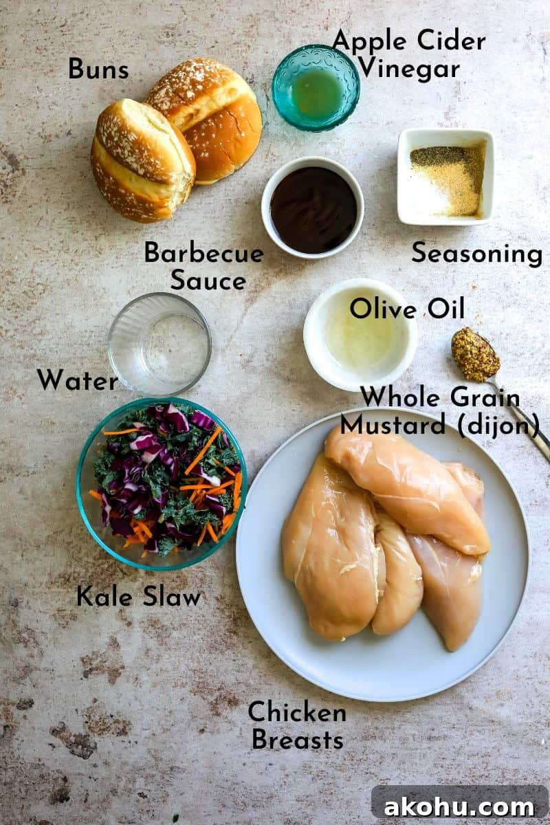 Ingredients on a counter on plates and in small bowls to make pulled chicken burgers.