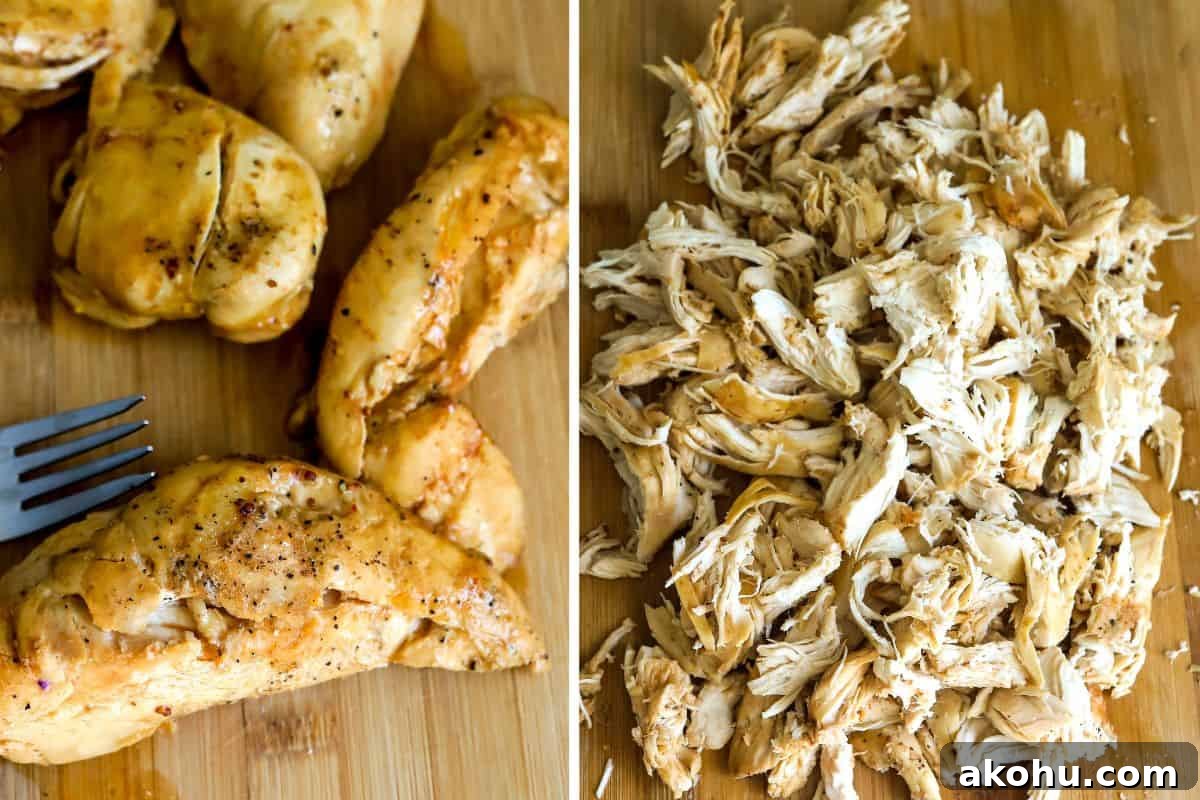 Pulled chicken cooked in the dutch oven on a cutting board whole and then shredded.