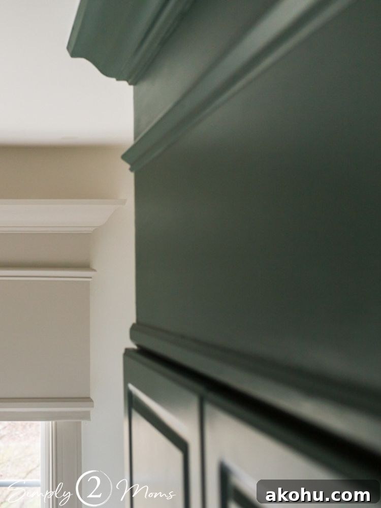 How to Close the Gap Above Kitchen Cabinets for a Finished Look 13 Custom green painted and trimmed cabinet topper to enclose space between cabinets and ceiling