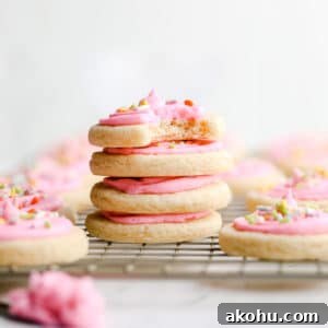 square image of stacked sugar cookies on rack