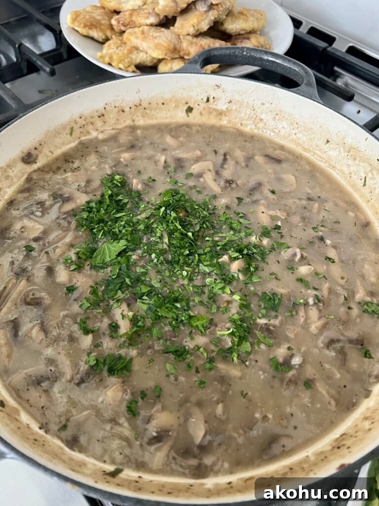 Chopped parsley added to sauce.