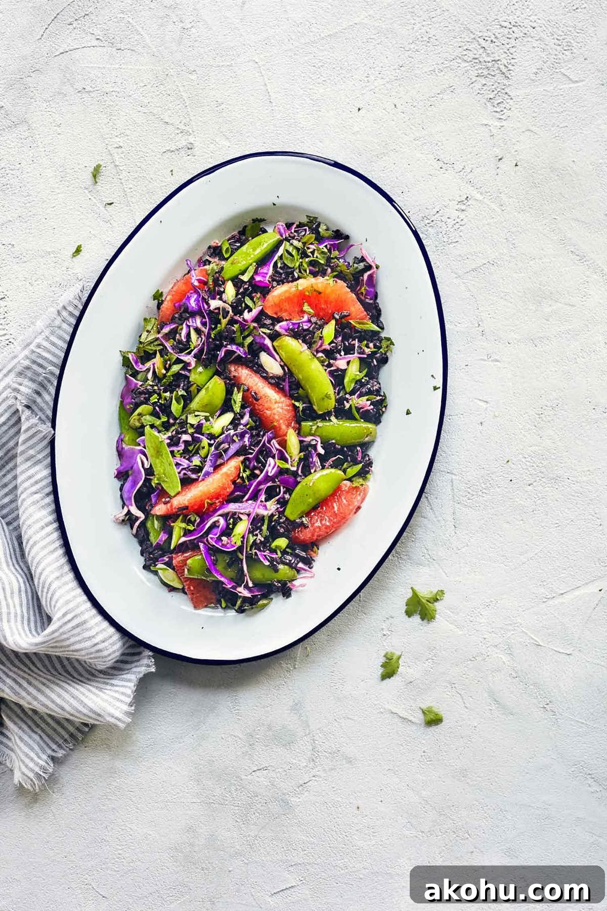 Citrus Ginger Black Rice Salad with Avocado & Mint 2 Asian black rice salad in a serving dish on the counter