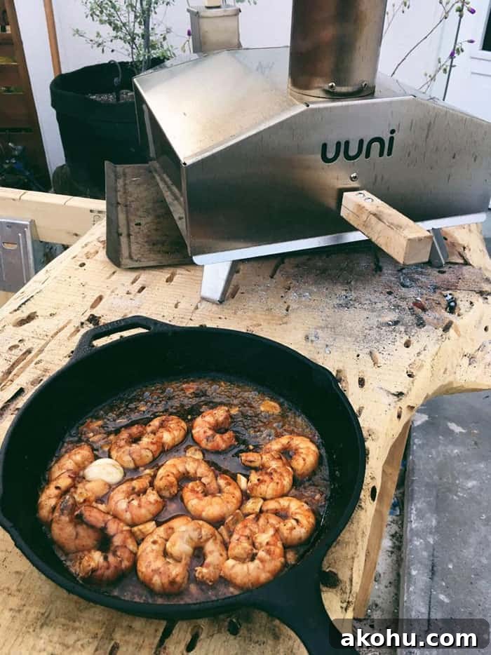 prawns in skillet being prepare in uuni oven