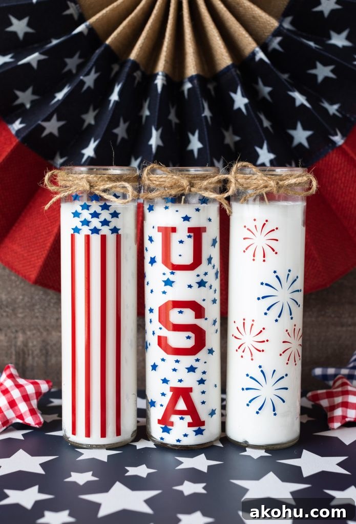 Patriotic Candles: Top Designs for Fourth of July & Memorial Day 2 tall white candle jars with vinyl decorations in American flag designs