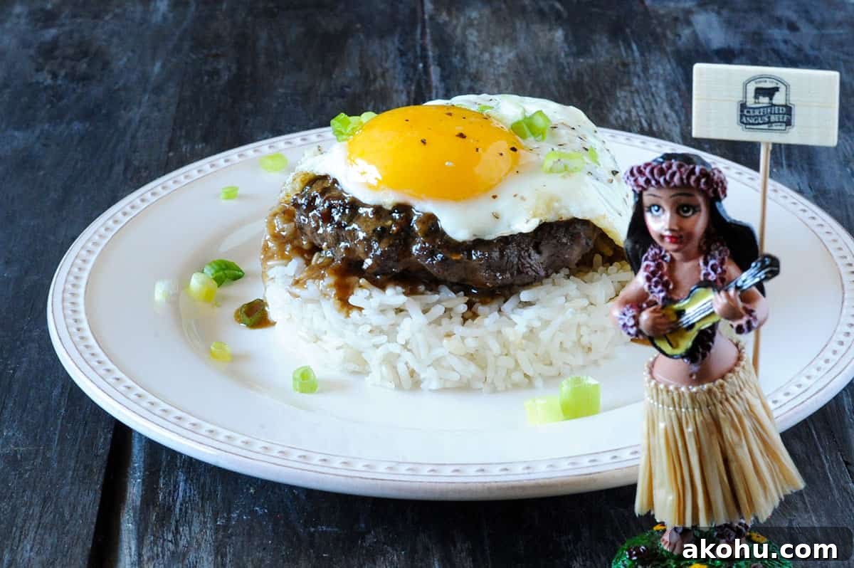 loco moco recipe: beef patty on rice with fried egg. 