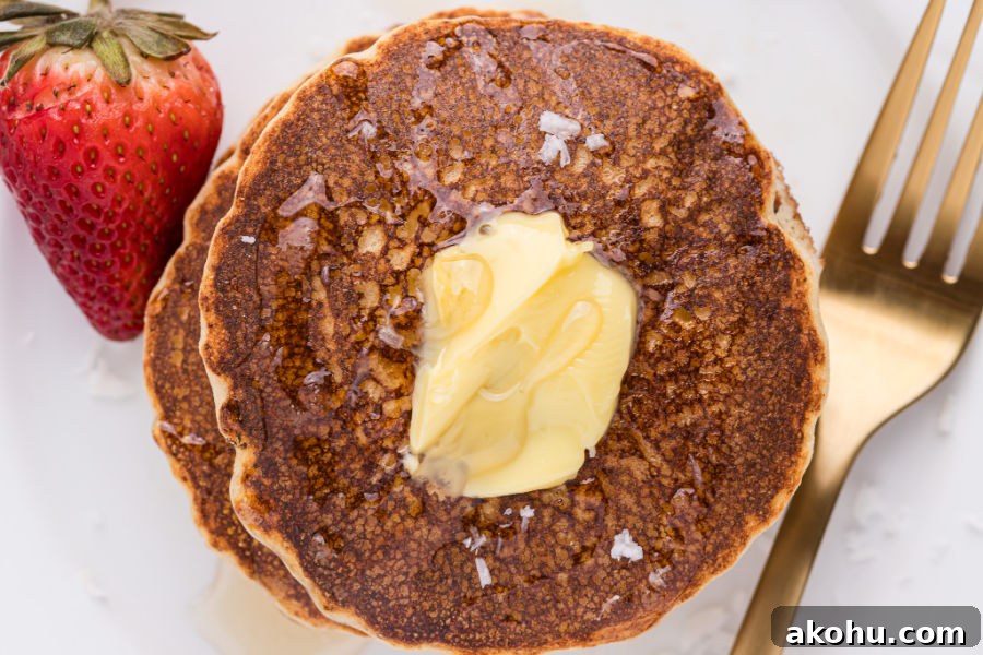 Pancake topped with butter and syrup.