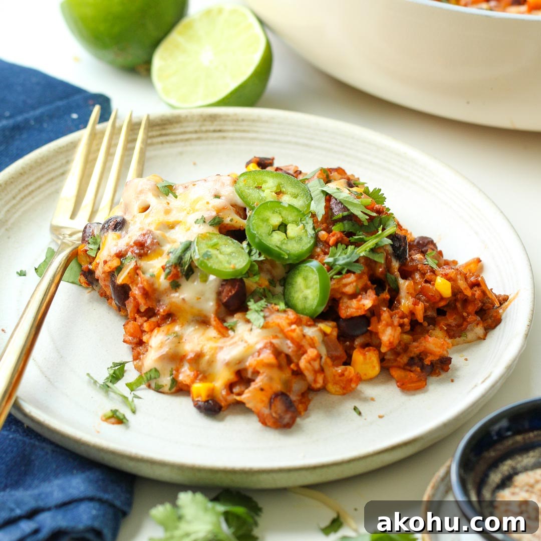 Easy Gluten-Free Dairy-Free Taco Rice Skillet made with ground beef, rice, black beans, corn, salsa, and dairy-free cheese. This simple one-pan dinner is family-friendly, budget-friendly, and perfect for busy weeknights. A hearty gluten-free dairy-free meal that reheats well for leftovers too.