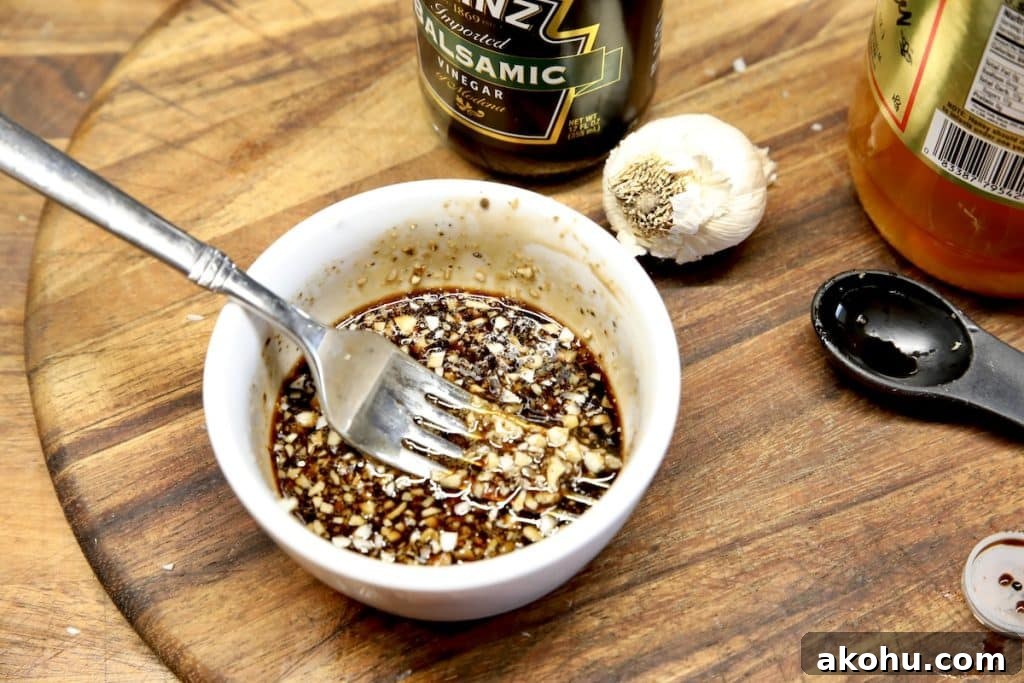 Honey Balsamic Glazed Steak Recipe for Weeknight Dinner 2 Balsamic glaze with honey and garlic in a bowl.