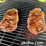 Honey Balsamic Glazed Steak Recipe for Weeknight Dinner 6 2 ribeye steaks on grill with balsamic glaze.